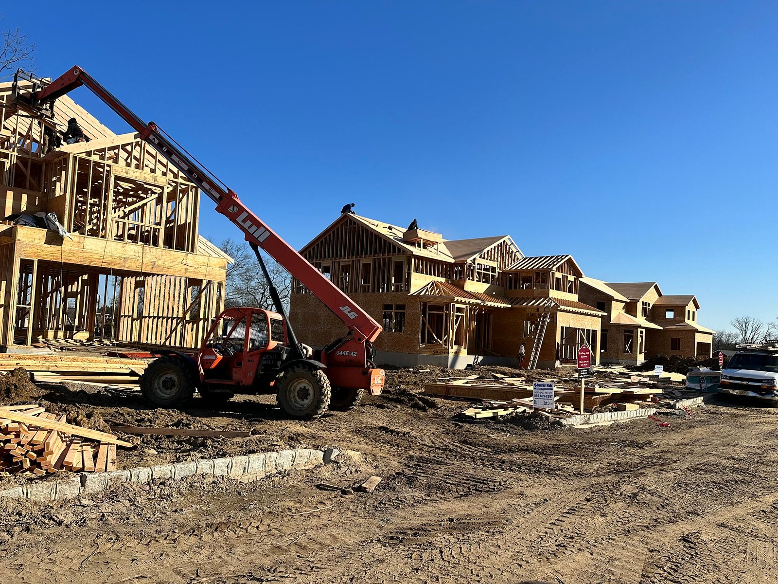 Framed two-story homes rising on a BayfordBridge parcel